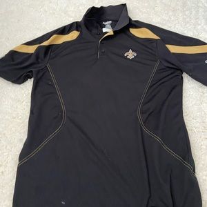 Saints Collard Shirt. The white spots on it are loose cotton pieces. Not stains